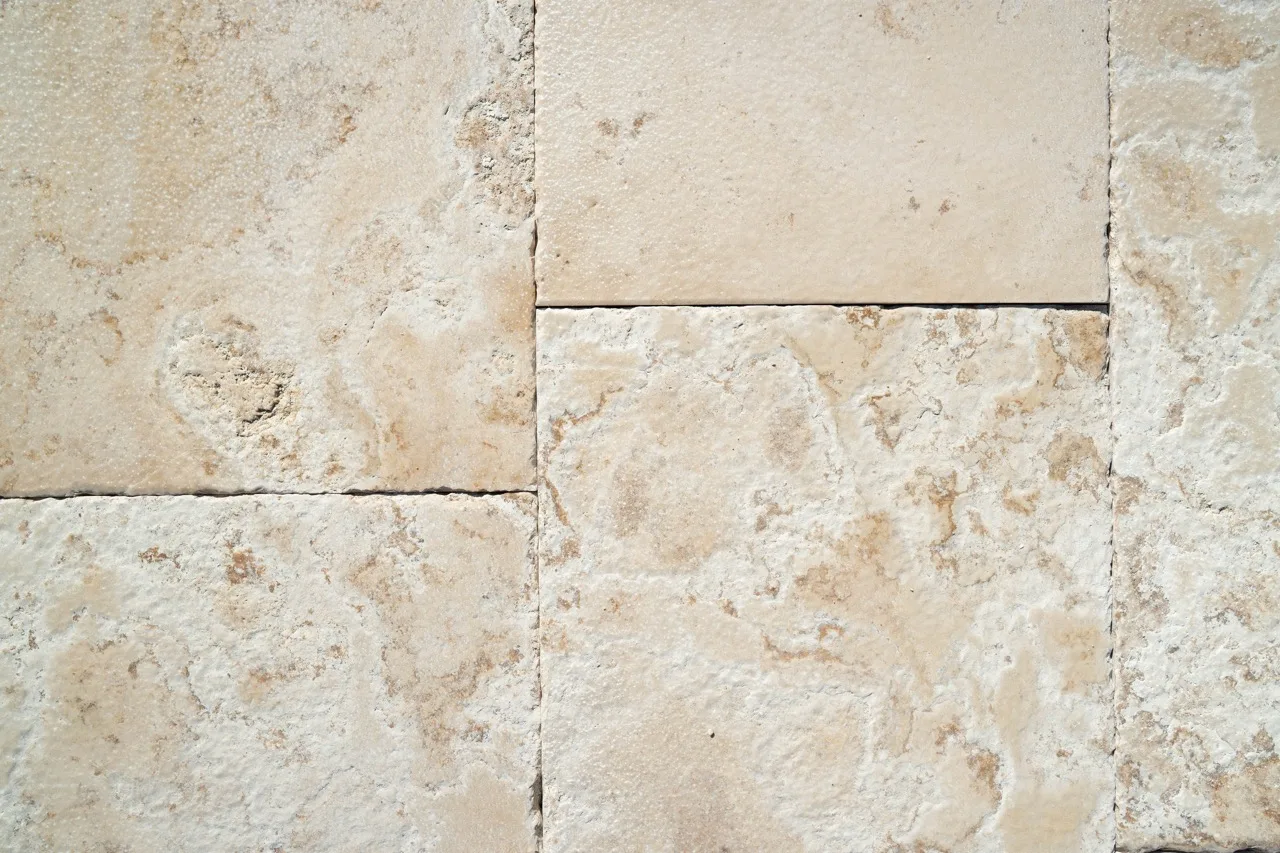 Hazel beige slabs with natural voids, veining and antiqued edges