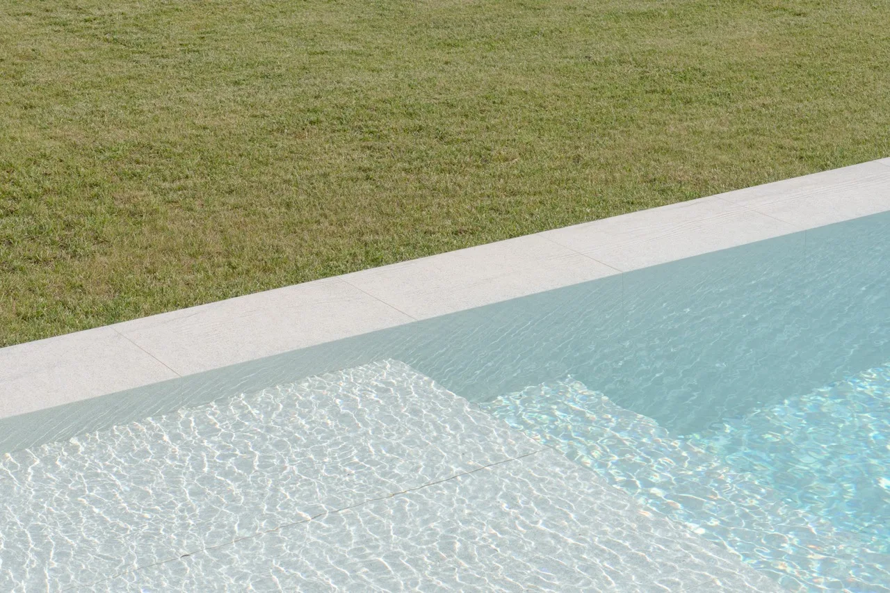 Trani stone pool surround with a non-slip surface
