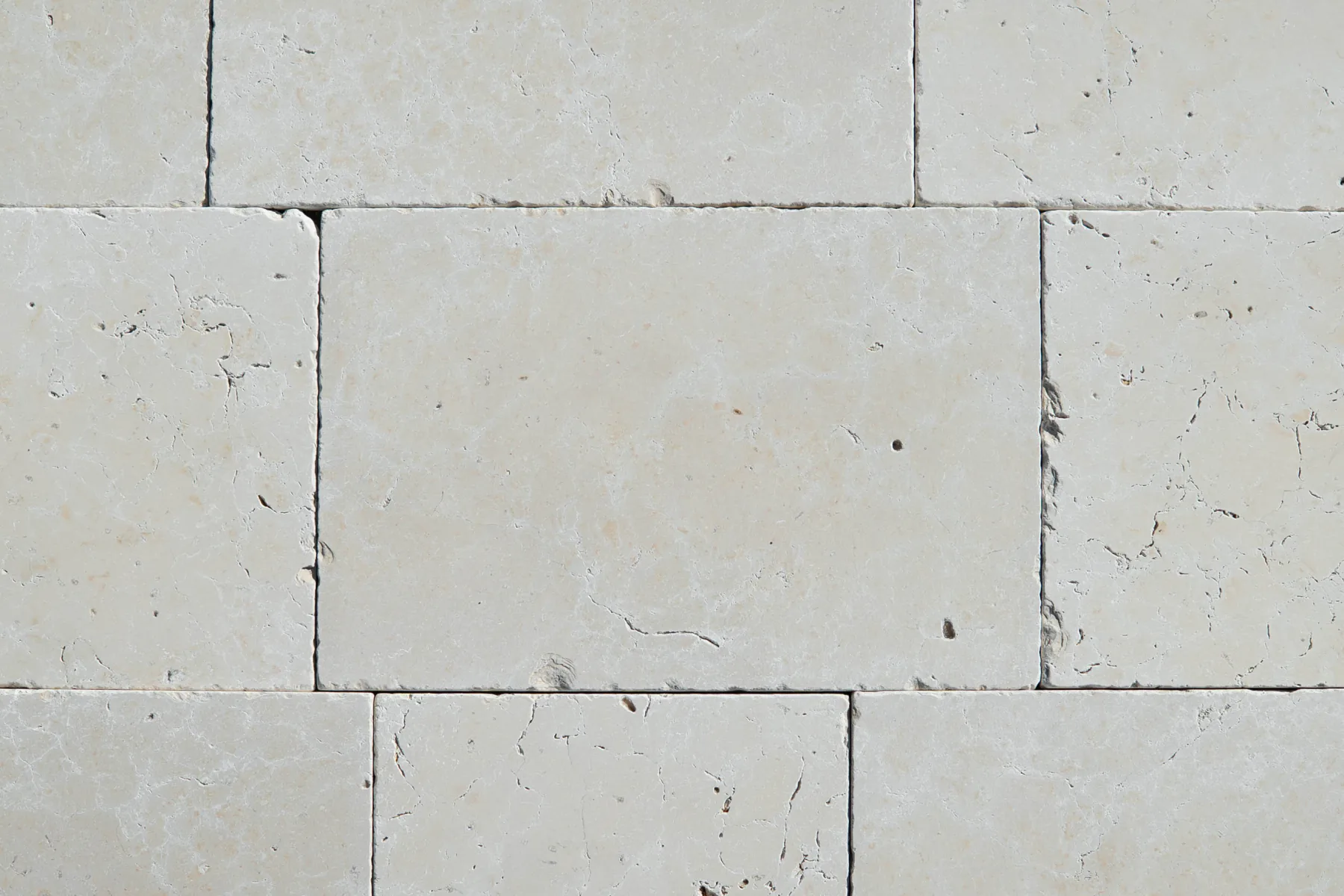 Antiqued ivory slabs with small voids and rounded edges